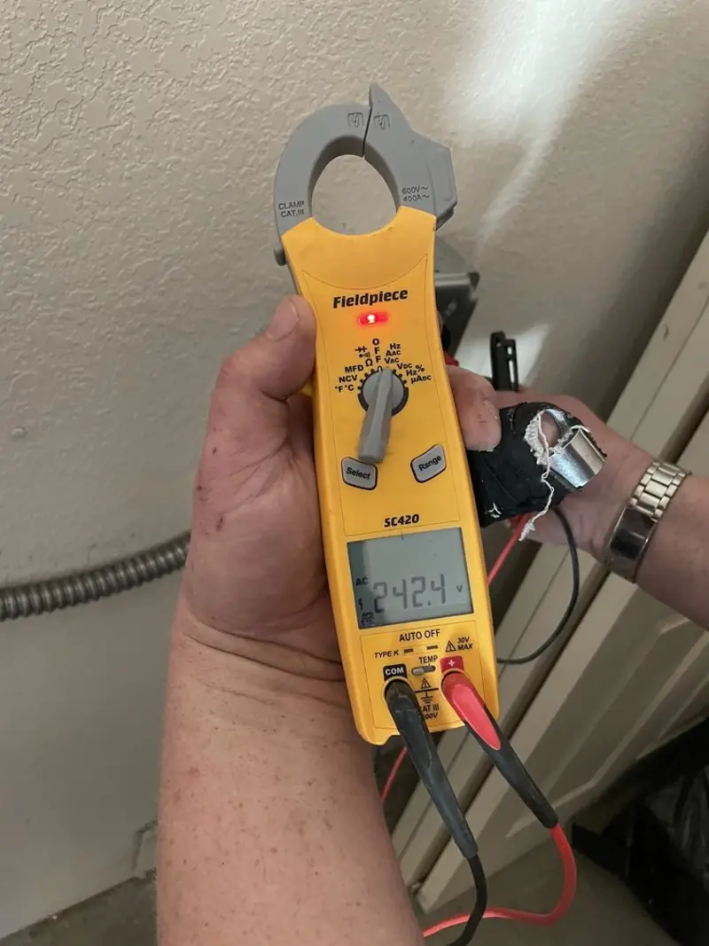Voltage testing with clamp meter during Electrical Installation Services in Ocoee